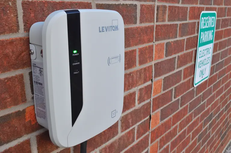 A wall-mounted electric-vehicle charging unit and cable